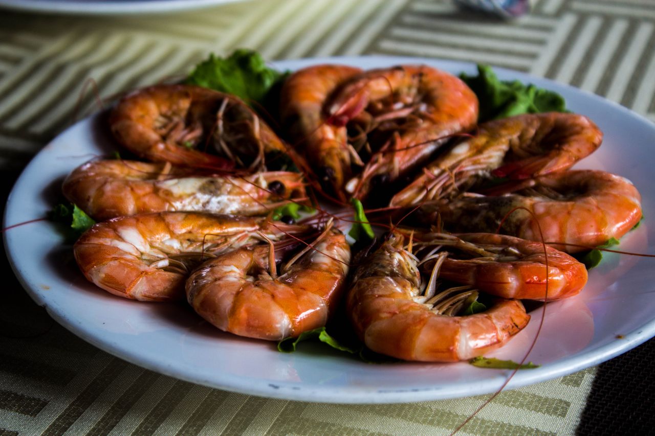 gallery-2 A close-up of a plate with cooked prawns, showcasing a delicious Vietnamese dish.